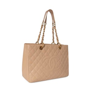 https://dbiyorq10n2b9.cloudfront.net/product-images/BAGCH0142/CHANEL-Quilted-Caviar-Grand-Shopping-Tote-Beige-1-1.jpg.webp