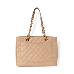 https://dbiyorq10n2b9.cloudfront.net/product-images/BAGCH0142/CHANEL-Quilted-Caviar-Grand-Shopping-Tote-Beige-2-1.jpg.webp