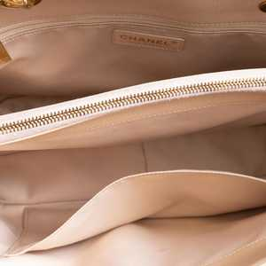 https://dbiyorq10n2b9.cloudfront.net/product-images/BAGCH0142/CHANEL-Quilted-Caviar-Grand-Shopping-Tote-Beige_7.jpg.webp