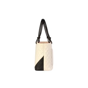 https://dbiyorq10n2b9.cloudfront.net/product-images/BAGCH116/CHANEL-Quilted-Leather-Ligne-Cambon-Large-Tote-White-side-1.jpg.webp