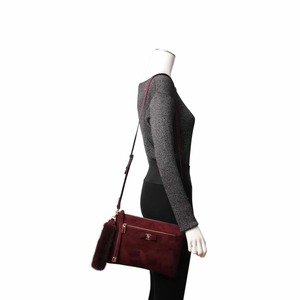 https://dbiyorq10n2b9.cloudfront.net/product-images/BAGFER0064/SALVATORE-FERRAGAMO-Suede-Crossbody-Bag-Clutch-Burgundy.jpg.webp