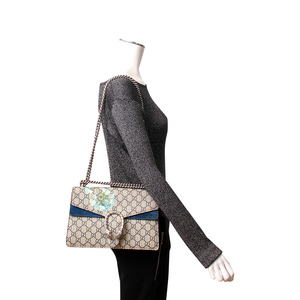https://dbiyorq10n2b9.cloudfront.net/product-images/BAGGUC0345/GUCCI-GG-Supreme-Bloom-Dionysus-Small-Shoulder-Bag-Blue-1.jpg.webp