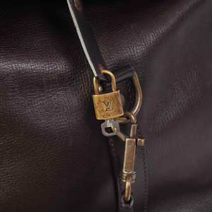 https://dbiyorq10n2b9.cloudfront.net/product-images/BAGLV205/LOUIS-VUITTON-Utah-Leather-Commanche-55-paddlock.jpg.webp