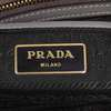 https://dbiyorq10n2b9.cloudfront.net/product-images/BAGPRA127/Prada-Pomice-Saffiano-Luxe-Leather-Tote-lable-close-up.jpg.webp