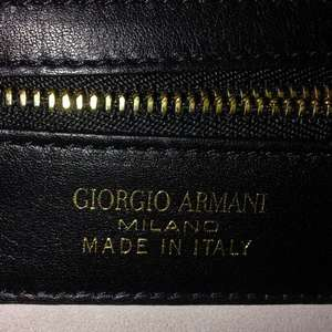 https://dbiyorq10n2b9.cloudfront.net/product-images/CBAGARM105/GIORGIO-ARMANI-Leather-Double-Handle-Tote-Black-close-up.jpg.webp