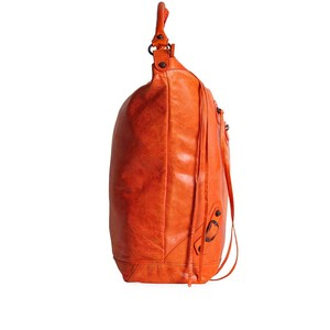 https://dbiyorq10n2b9.cloudfront.net/product-images/CBAGBAL103/BALENCIAGA-Lambskin-Leather-Courier-Bag-orange-Side-1.jpg.webp