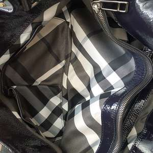 https://dbiyorq10n2b9.cloudfront.net/product-images/CBAGBUR0020/BURBERRY-Patent-Leather-Hobo-Dark-Purple-interior.jpg.webp