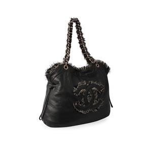 https://dbiyorq10n2b9.cloudfront.net/product-images/CBAGCH0005/CHANEL-Leather-Tweedy-CC-Tote-Grey-angle.jpg.webp
