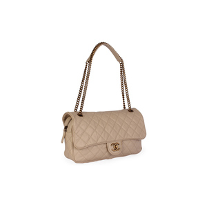 https://dbiyorq10n2b9.cloudfront.net/product-images/CBAGCH118/CHANEL-Quilted-Glazed-Caviar-Leather-Large-Shiva-Flap-Bag-Beige-angle.jpg.webp