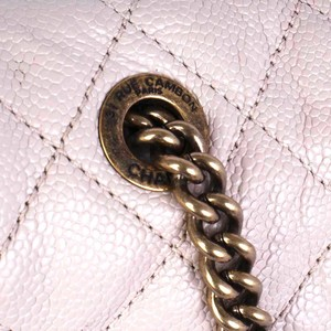 https://dbiyorq10n2b9.cloudfront.net/product-images/CBAGCH118/CHANEL-Quilted-Glazed-Caviar-Leather-Large-Shiva-Flap-Bag-Beige-close-up-1.jpg.webp