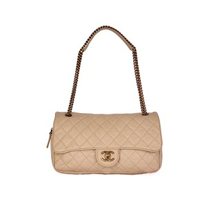 https://dbiyorq10n2b9.cloudfront.net/product-images/CBAGCH118/CHANEL-Quilted-Glazed-Caviar-Leather-Large-Shiva-Flap-Bag-Beige-front.jpg.webp