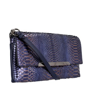 https://dbiyorq10n2b9.cloudfront.net/product-images/CBAGCL0050/CHRISTIAN-LOUBOUTIN-Python-Rougissime-Clutch-Bag-Metallic-Blue._1.jpg.webp