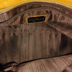 https://dbiyorq10n2b9.cloudfront.net/product-images/CBAGFER113/SALVATORE-FERRAGAMO-Pebbled-Calfskin-Leather-Medium-Sofia-Bag-Yellow-Mustard-interior.jpg.webp