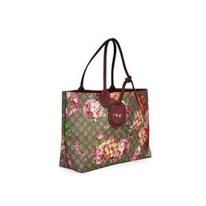 https://dbiyorq10n2b9.cloudfront.net/product-images/CBAGGUC436/GUCCI-GG-Blooms-Reversible-Tote-angle.jpg.webp