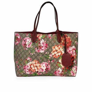 https://dbiyorq10n2b9.cloudfront.net/product-images/CBAGGUC436/GUCCI-GG-Blooms-Reversible-Tote-front.jpg.webp