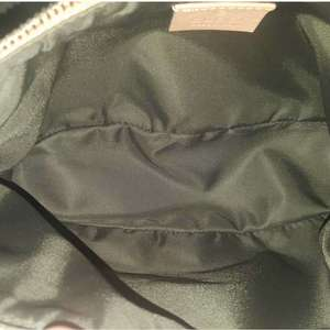 https://dbiyorq10n2b9.cloudfront.net/product-images/CBAGGUC441/GUCCI-Signature-GG-Pochette-interior.jpg.webp