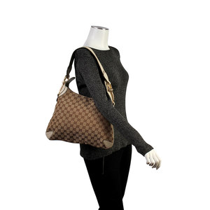 https://dbiyorq10n2b9.cloudfront.net/product-images/CBAGGUC453/GUCCI-GG-Horsebit-Hobo-Beige-mannequin.jpg.webp