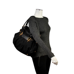 https://dbiyorq10n2b9.cloudfront.net/product-images/CBAGGUC454/GUCCI-GG-Jockey-Medium-Tote-Black-mannequin.jpg.webp