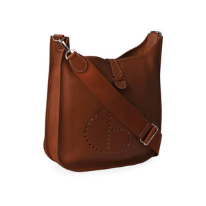 https://dbiyorq10n2b9.cloudfront.net/product-images/CBAGHER0001/HERMES-Clemence-Evelyne-III-GM-Tabaco-angle.jpg.webp