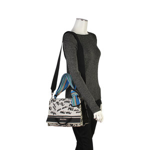 https://dbiyorq10n2b9.cloudfront.net/product-images/CBAGMIU109/MIU-MIU-Denim-Logo-Print-Shoulder-Bag-BlackWhite-mannequin.jpg.webp