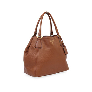 https://dbiyorq10n2b9.cloudfront.net/product-images/CBAGPRA0015/PRADA-Vitello-Daino-Tote-Brown-angle-1.jpg.webp