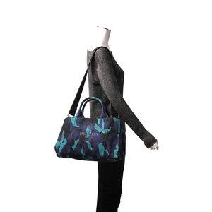 https://dbiyorq10n2b9.cloudfront.net/product-images/CBAGPRA0073/PRADA-Canapa-Camouflage-Tote-Blue.jpg.webp