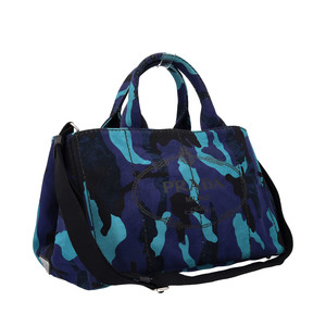 https://dbiyorq10n2b9.cloudfront.net/product-images/CBAGPRA0073/PRADA-Canapa-Camouflage-Tote-Blue_9.jpg.webp