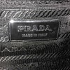 https://dbiyorq10n2b9.cloudfront.net/product-images/CBAGPRA136/PRADA-Saffiano-Lux-Bauletto-Bag-Black-close-up.jpg.webp