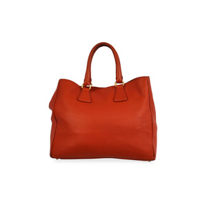 https://dbiyorq10n2b9.cloudfront.net/product-images/CBAGPRA159/PRADA-Pebbled-Leather-Tote-Orange-back.jpg.webp