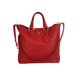https://dbiyorq10n2b9.cloudfront.net/product-images/CBAGPRA166/PRADA-Vitello-Daino-Large-Shopper-Tote-Red-front.jpg.webp