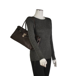 https://dbiyorq10n2b9.cloudfront.net/product-images/CBAGPRA170/PRADA-Leather-Vintage-Shoulder-Bag-Brown-mannequin.jpg.webp