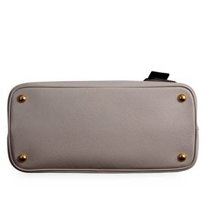 https://dbiyorq10n2b9.cloudfront.net/product-images/CBAGPRA182/PRADA-Saffiano-Cuir-Small-Double-Bag-White-NEW-bottom.jpg.webp