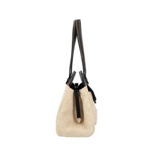 https://dbiyorq10n2b9.cloudfront.net/product-images/CBAGTOD0022/TODS-Leather-Canvas-Shoulder-Bag-Black-Ivory_3.jpg.webp