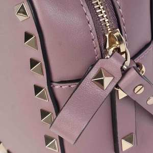 https://dbiyorq10n2b9.cloudfront.net/product-images/CBAGVA102/VALENTINO-Rockstud-Camera-Crossbody-Bag-Exterior-detal-clse-up.jpg.webp
