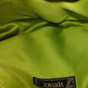https://dbiyorq10n2b9.cloudfront.net/product-images/CBAGVER103/VERSACE-Vintage-Leather-Clutch-Brown-interior.jpg.webp