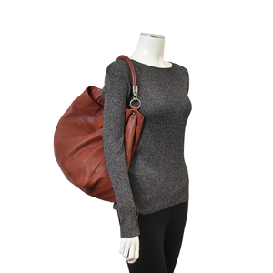 https://dbiyorq10n2b9.cloudfront.net/product-images/CBAGYSL0019/YVES-SAINT-LAURENT-Leather-Roady-Hobo-Brown-Mannequin.jpg.webp