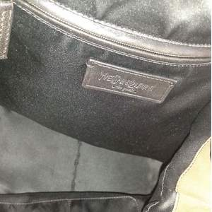 https://dbiyorq10n2b9.cloudfront.net/product-images/CBAGYSL0019/YVES-SAINT-LAURENT-Leather-Roady-Hobo-Brown-interior.jpeg.webp