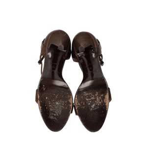 https://dbiyorq10n2b9.cloudfront.net/product-images/CSHOBAL0048/BALENCIAGA-Leather-Buckle-Strap-Sandals-Brown_1.jpg.webp