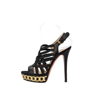 https://dbiyorq10n2b9.cloudfront.net/product-images/CSHOCAS0046/CASADEI-Leather-Caged-Platform-Sandals-Black-Gold_2.jpg.webp