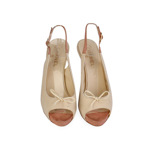 https://dbiyorq10n2b9.cloudfront.net/product-images/CSHOCH120/CHANEL-Fabric-Sling-Back-Pumps-Cream-S-40-65-front.jpg.webp
