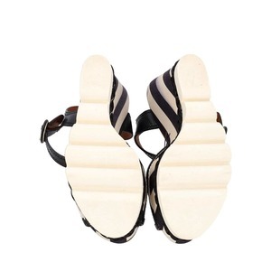 https://dbiyorq10n2b9.cloudfront.net/product-images/CSHODG0201/DOLCE-GABBANA-Raffia-Striped-Wedge-Sandals-Black-White_5.jpg.webp