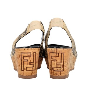 https://dbiyorq10n2b9.cloudfront.net/product-images/CSHOFEN0053/FENDI-Patent-Python-Leather-Wedge-Sandals-Beige_4.jpg.webp