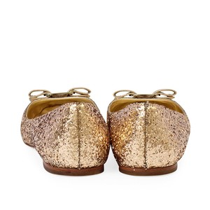 https://dbiyorq10n2b9.cloudfront.net/product-images/CSHOFER0022/SALVATORE-FERRAGAMO-Glitter-Varina-Ballerina-Flats-Gold-S-42-7.5-back.jpg.webp