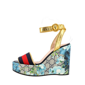 https://dbiyorq10n2b9.cloudfront.net/product-images/CSHOGUC0321/GUCCI-GG-Blooms-Wedge-Sandals-Multicolour_1.jpg.webp