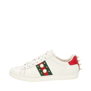 https://dbiyorq10n2b9.cloudfront.net/product-images/CSHOGUC0561/GUCCI-Leather-Ace-Faux-Pearl-Spike-Sneakers-White_1.jpg.webp
