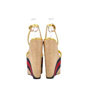 https://dbiyorq10n2b9.cloudfront.net/product-images/CSHOGUC0758/GUCCI-Leather-Espadrille-Wedges-Gold_2.jpg.webp