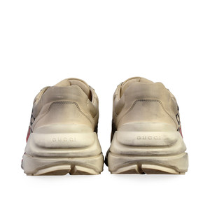 https://dbiyorq10n2b9.cloudfront.net/product-images/CSHOGUC231/GUCCI-Leather-Mouth-Print-Rhyton-Sneakers-White-S-44-9.5-back.jpg.webp