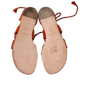 https://dbiyorq10n2b9.cloudfront.net/product-images/CSHOHER0011/HERMES-SuedeLeather-Gladiator-Wrap-Sandals-Brick-Red-soles.jpg.webp