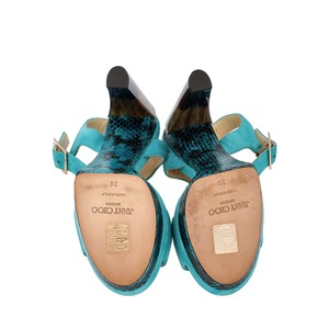 https://dbiyorq10n2b9.cloudfront.net/product-images/CSHOJC0334/JIMMY-CHOO-Suede-Python-Dora-Platform-Sandals-Turquoise_5.jpg.webp