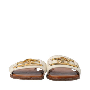 https://dbiyorq10n2b9.cloudfront.net/product-images/CSHOLV0278/LOUIS-VUITTON-Leather-Lock-It-Flat-Mules-Blanc_1.jpg.webp